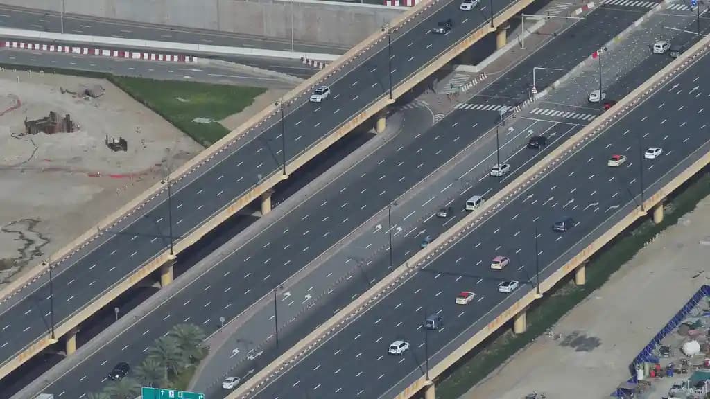Real photograph of cars travelling on multilane roads in Dubai, photographed by Roman Logov.